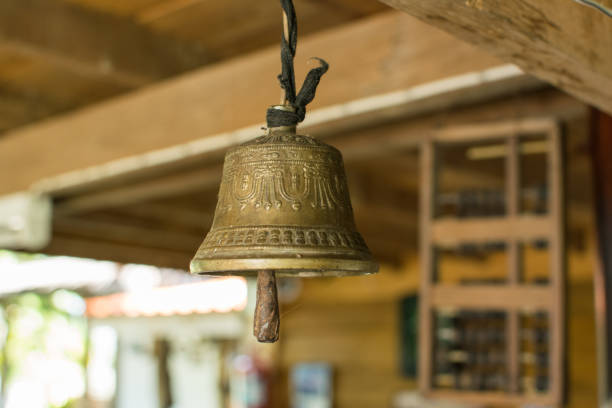 istock Old brass bell hanging on the ceiling. temple, vintage, ancient, object, 993730812