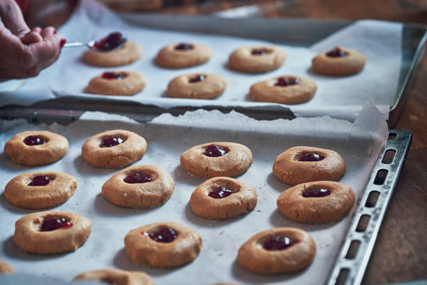 istock Preparing Peanut Butter Cookies with Marmalade in Domestic Kitchen 993733246