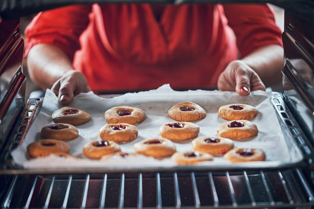 istock Preparing Peanut Butter Cookies with Marmalade in Domestic Kitchen 993733282