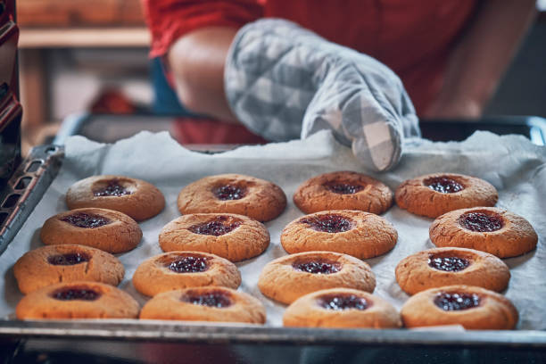 istock Preparing Peanut Butter Cookies with Marmalade in Domestic Kitchen 993733290