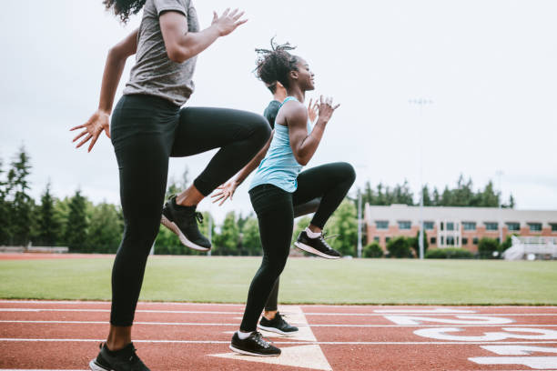 istock Women Athletes Run and Train for Track and Field 993741650