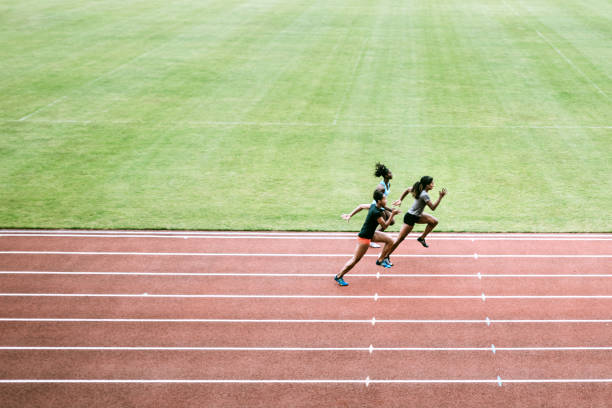 istock Women Athletes Run and Train for Track and Field 993744778
