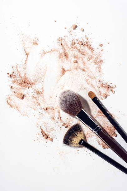 istock Foundation smears and make up brushes on white background 993745532