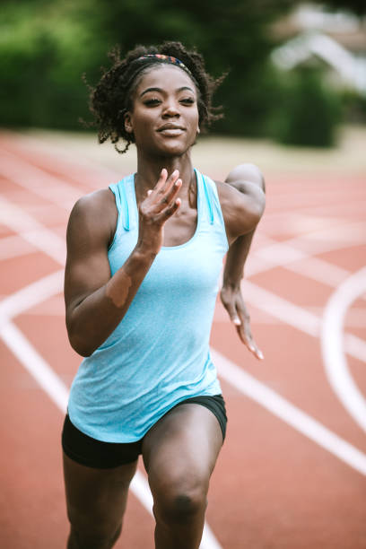 istock Woman Athlete Sprints Hard for Track and Field 993748140