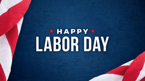 istock Happy Labor Day Text Over Dark Blue Background with American Flags 993757804