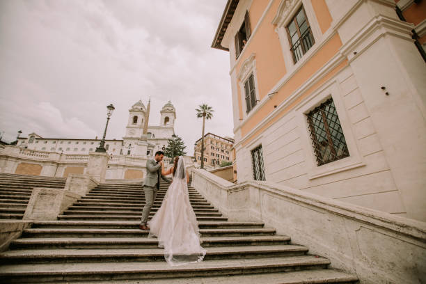 istock Young wedding couple on Spanish stairs in Rome 993760234