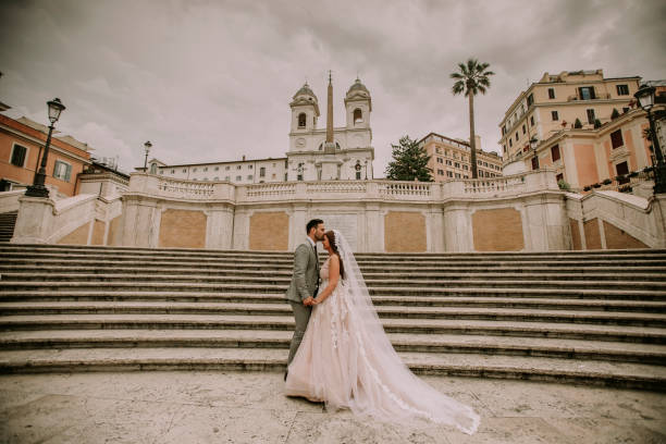 istock Young wedding couple on Spanish stairs in Rome 993760238