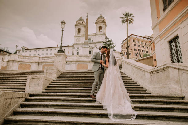 istock Young wedding couple on Spanish stairs in Rome 993760248