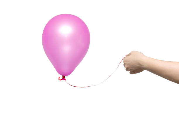 istock Pink balloon holded in a hand 993760346