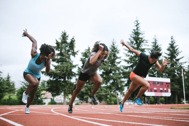 istock Woman Athletes At Race Starting Line Ready to Run 993760842