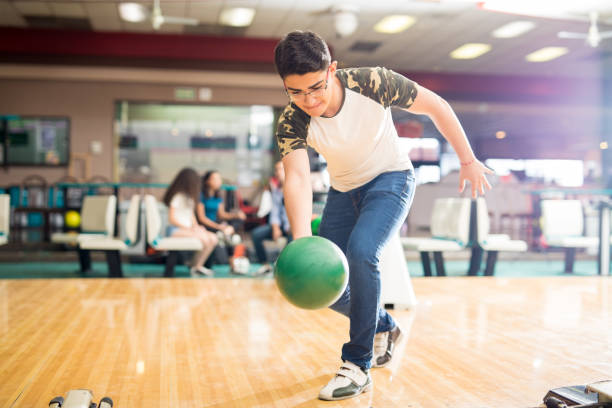 istock Boy Practicing His Swing At A Bowling Alley 993763154