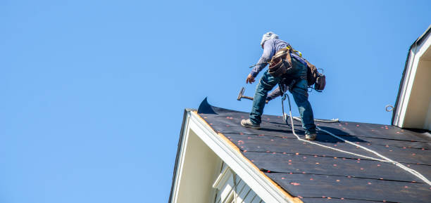 Roofing Contractors Replacing Damaged Roofs After a Hail Storm stock photo