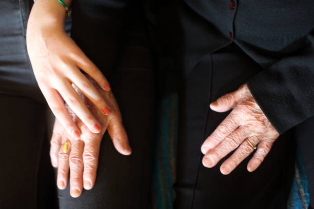 istock Young girl holding senior‘s hand 993766698