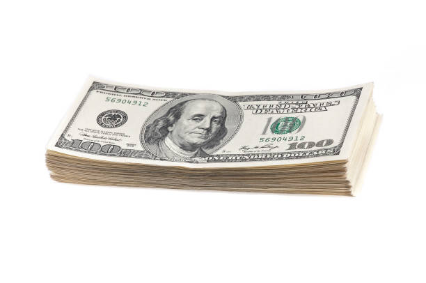 istock A stack of one hundred dollar bills on a white background. Isolated. 993773342