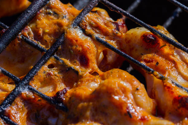 istock Grilled chicken in the garden. Barbeque. 993773988