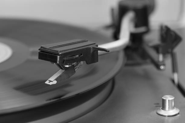 istock Old stereo vinyl record player. The stylus over a vinyl record 993788880