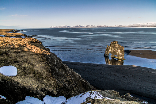 Hvitserkur troll rock, high basalt stack located off the shore of north-west Iceland. The stack has the appearance of a dragon, or elephant drinking sea water in Vatnsnes peninsula. Epic and beautifull landscape.