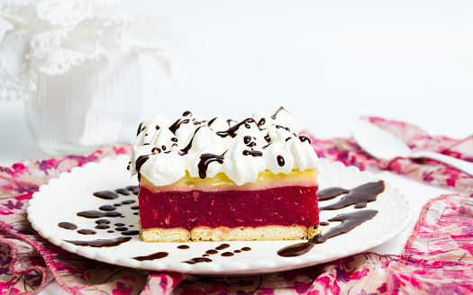 Cherry fruit cake with cream on a plate