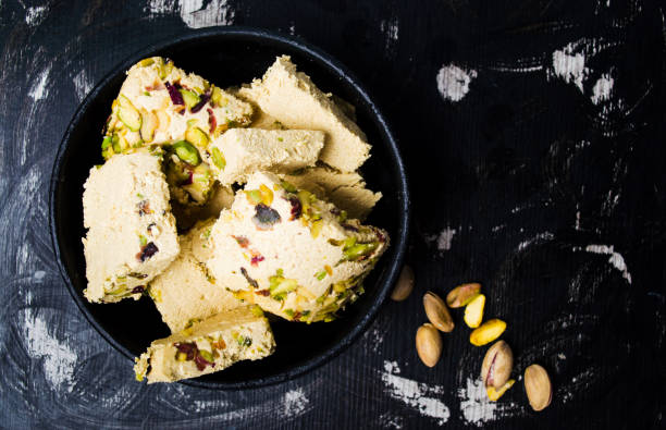 istock Halva with pistachio on dark background 993789758
