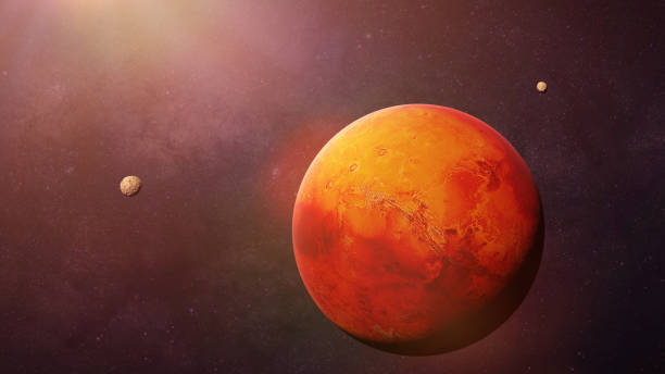 istock the red planet Mars with it moons Phobos and Deimos, part of the solar system 993795318