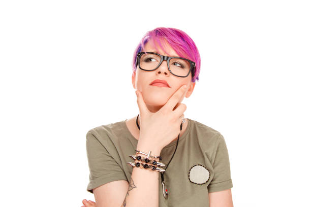 Portrait puzzled pensive woman thinking worried finger on chin gesture looking up to side daydreaming isolated white wall background. Human face expressions emotions feelings body language perception