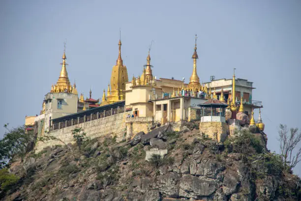 The Taung Kalat Monastery atop a volcanic plug that rises 657 metres (2,156 ft) above the sea level, with the only access up 777 steps. Popularly known as Mount Popa, it is located next to the volcano of that name.