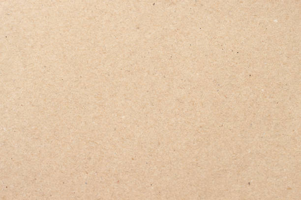 istock Cardboard, beige paper texture cardboard background close-up, surface with small inclusions of cellulose 993956012