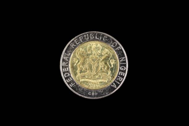 istock Nigerian One Naira Coin Isolated On A Black Background 993957160