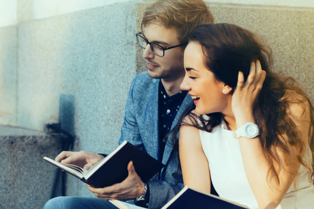 istock Happy couple reading books 993957312