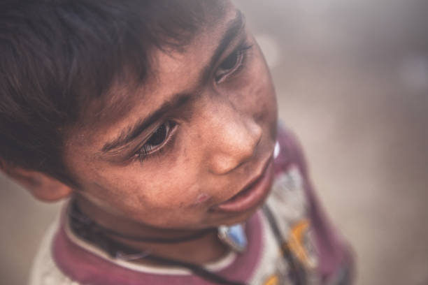 istock A portrait of a poor child from India 993957634