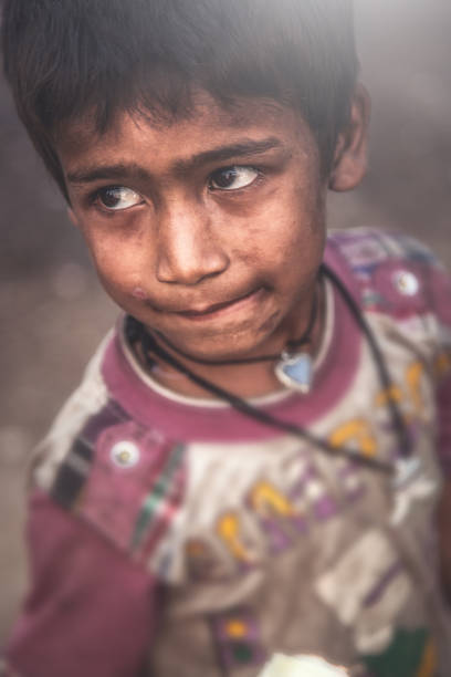 istock A portrait of a poor child from India 993957656