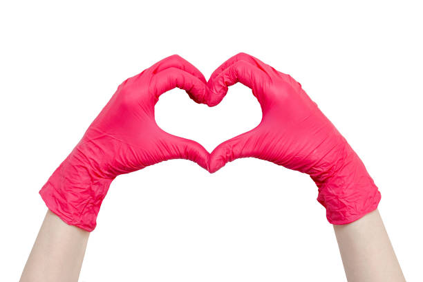 Heart made of red medical gloves stock photo