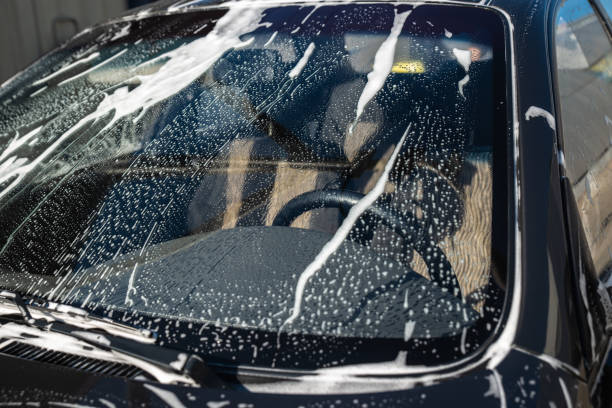 istock car in soap at carwash service. windshield 993958038
