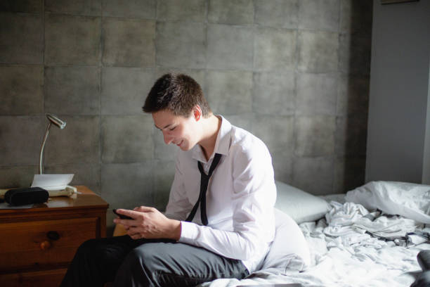 istock Teenage boy using his mobile phone 993959758