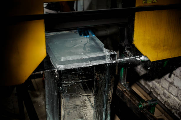 istock Man cutting an ice cube with a special tool on the plant 993961160