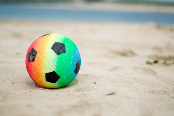 istock football on beach 993961986