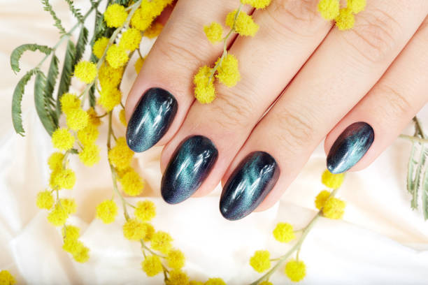 istock Hand with manicured nails with cat eye design 993963150