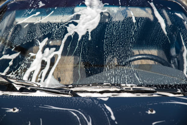 istock car in soap at carwash service. windshield 993963438