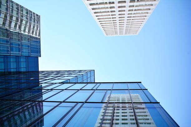 istock Blue clean glass wall of modern skyscraper 993963738