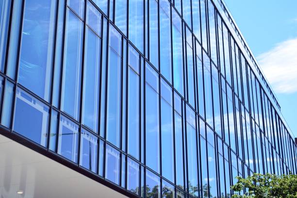 istock Blue clean glass wall of modern skyscraper 993964300