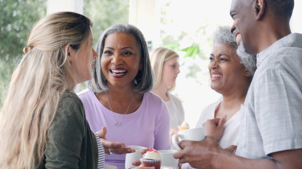 istock Happy friends enjoying time together at a fundraiser 993965352