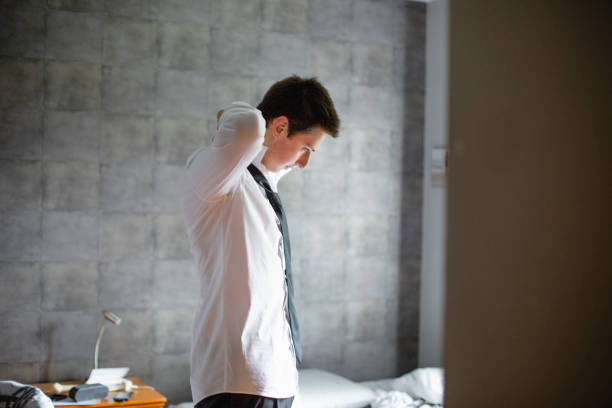istock Teenage boy getting dress for an event 993965680