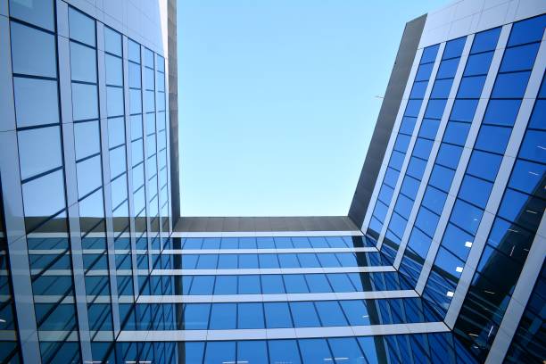 istock Blue clean glass wall of modern skyscraper 993965714
