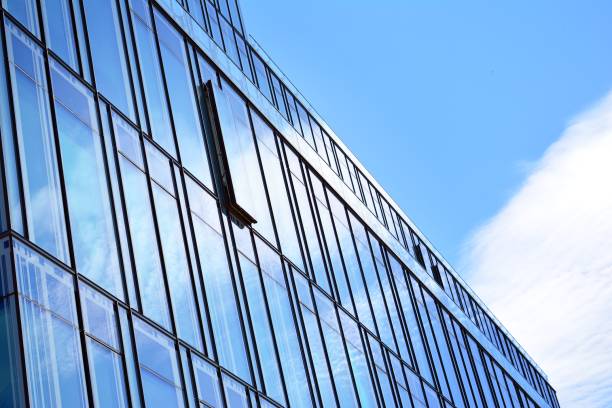 istock Blue clean glass wall of modern skyscraper 993967790