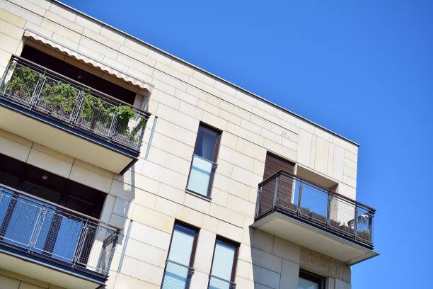 istock Brand new apartment building on sunny day 993968120