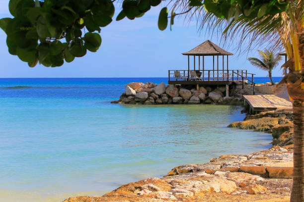 istock Beach with rustic gazebo on breakwater – Montego Bay - Jamaica, Caribbean 993969684