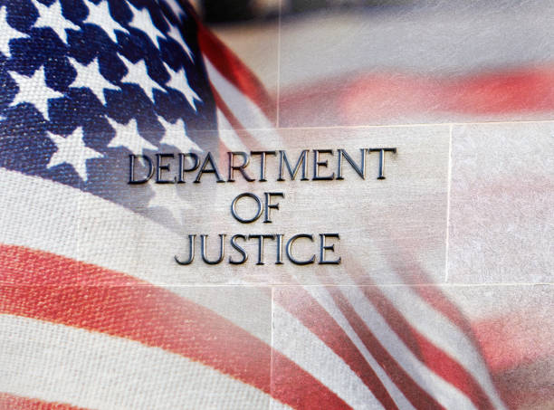 Department of Justice Building Sign with Flag stock photo