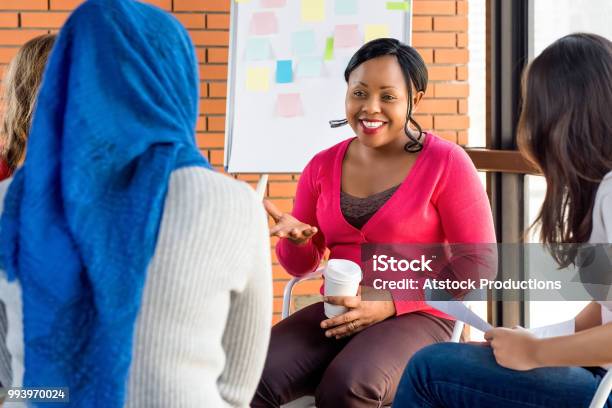 Diverse Group Of Women In Colorful Clothes At The Meeting Stock Photo - Download Image Now