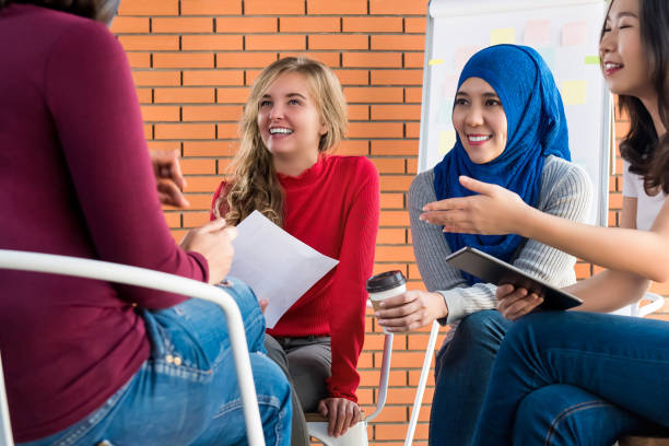 istock Casual multiethnic women meeting for social project 993970048