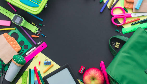 istock Banner Concept back to school apple backpack stationery on black background. 993978126
